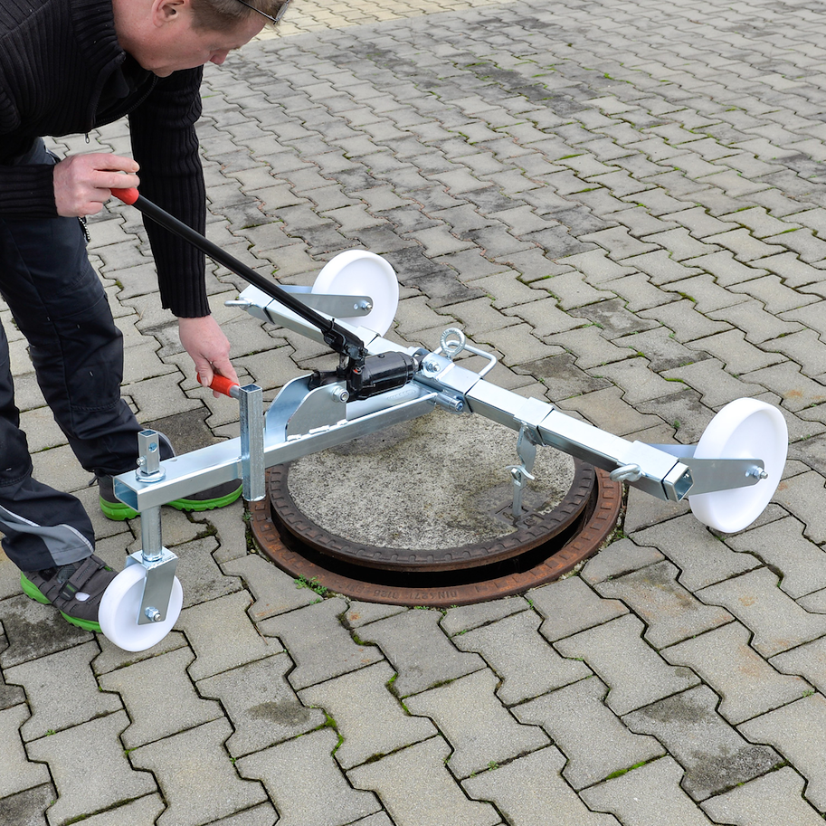 Hydraulischer Kanaldeckelheber mit Fahrwerk